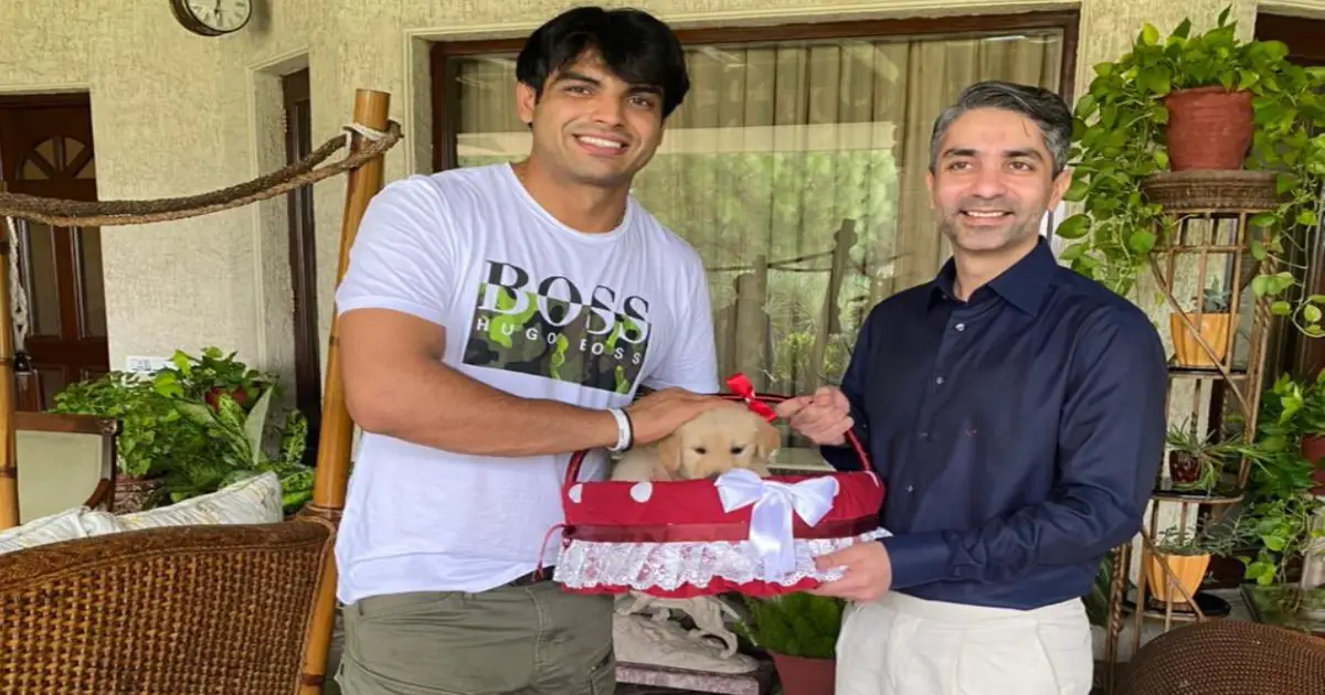 Abhinav Bindra presents Neeraj Chopra with a puppy named 'Tokyo'